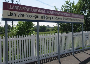 Llanfairpwllgwyngyllgogerychwyrndrobwllllantysiliogogogoch_station_sign_(cropped_version_1)