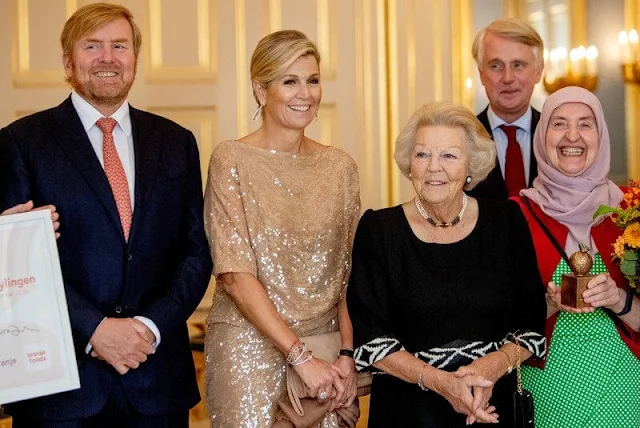 Queen Maxima wore a beige, cream sequin midi dress by Natan. King Willem-Alexander and Princess Beatrix