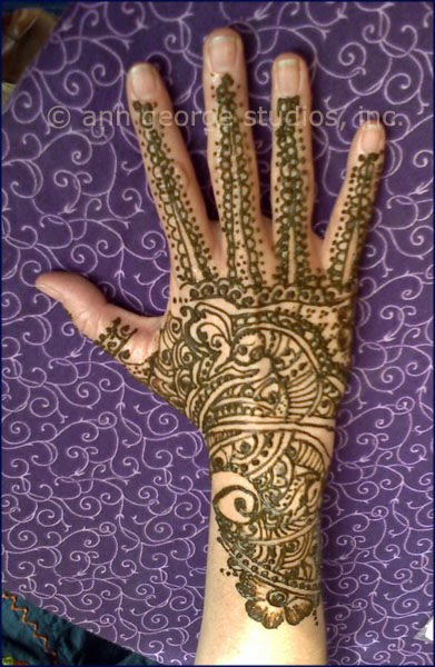 Here is a photo of bridal style henna tattoo This is a full back hand henna