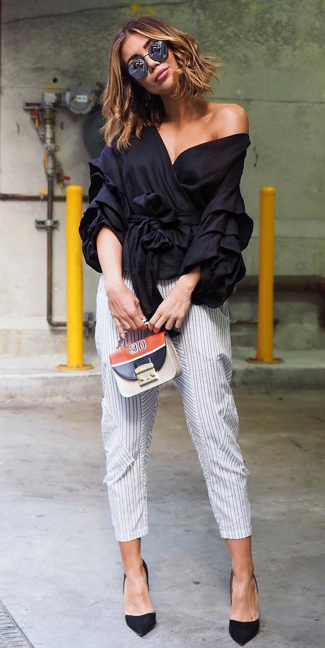 stylish look | black ruffle blouse + bag + heels + stripped pants