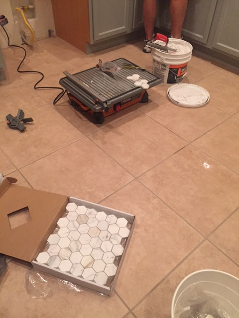 Progress pf Calacatta Gold marble mosaic wall at Hello Lovely Arizona Fixer Upper Kitchen