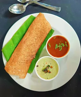 Serving dosa with coconut chutney and sambhar for indian breakfast menu and ideas