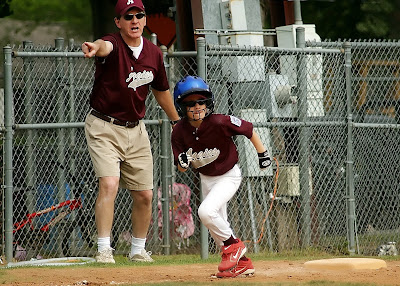 a coach doing his job