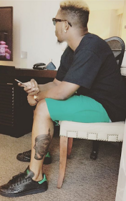 https://dab247.blogspot.com/Olamide shows off his Oduduwa leg tattoo