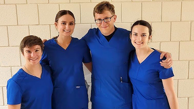 Williamson (pictured 2nd from the left) with her fireteam outside of the Anatomy Lab before class. (Photo courtesy of Air Force 2nd Lt. Samantha Williamson)