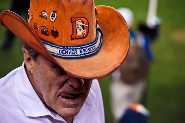 A Denver Broncos fan licking his lips after a 33-19 victory of the Pittsburgh Steelers.