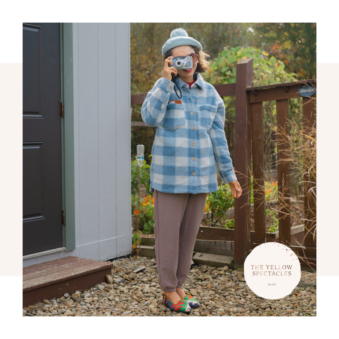 Female in blue and white plaid jacket