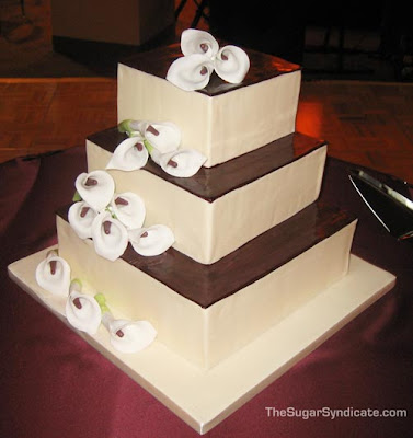 Square wedding cakes with lilies