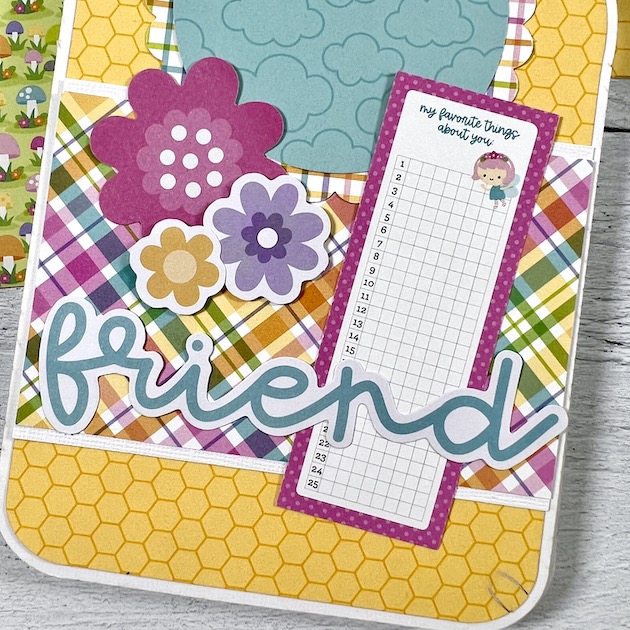 Jar shaped scrapbook page with flowers and fairy journaling card