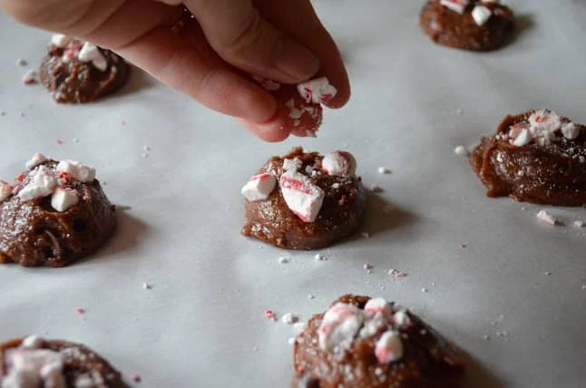 Peppermint Chocolate Chip Cookie Dough Balls with crushed soft peppermint candies on top.