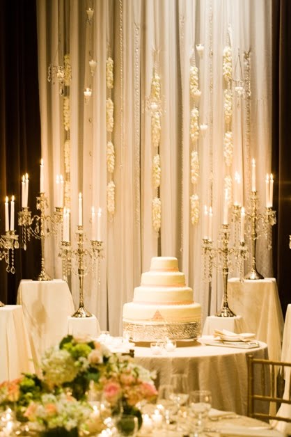 The reception tables were draped in gold embroidered overlays and two