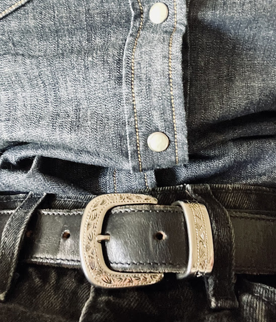 Close up of vintage belt and denim