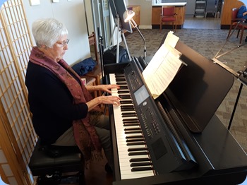 Claudette Wheeler playing the Village's Yamaha Clavinova CVP-709