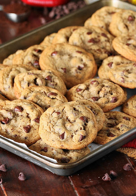 Full Batch of Coffee Chocolate Chip Cookies Piled on Cookie Sheet Image