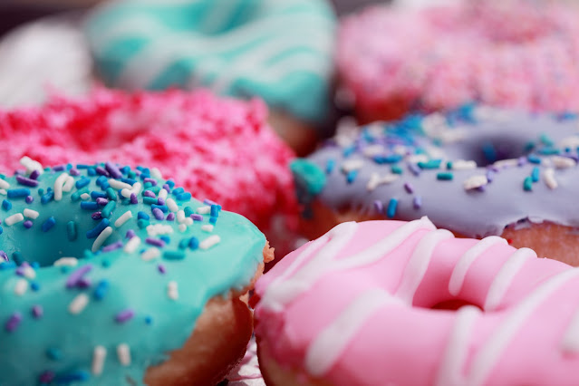 iced doughnuts:Photo by Alexander Grey on Unsplash