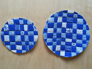 circles cut from panel, one small and one bigger