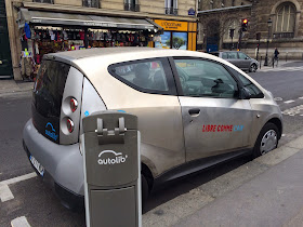 Pic of electric car recharging in Paris street