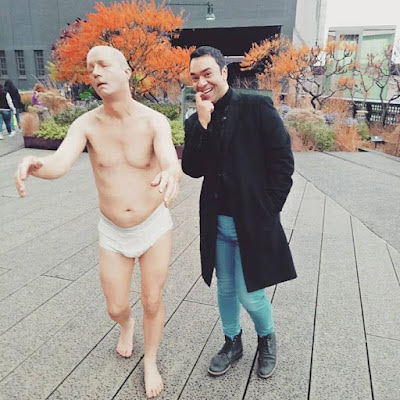 Editor and Author, Amit Anand at the High Line Park in New York City standing along Tony Matelli's Sleepwalker installation. The title of the Photo says "Does It Spark Joy"
