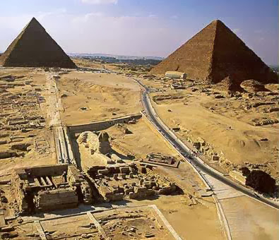 A view of the Giza Plateau with the Great Sphinx and its temples in the foreground