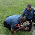 Disturbing Facebook video shows boy, TEN, being pinned to the ground and restrained by two police officers