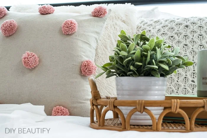 pink pom pom pillow