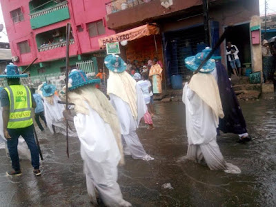 Photos: Eyo masquerades defy rainfall, move around in their attire