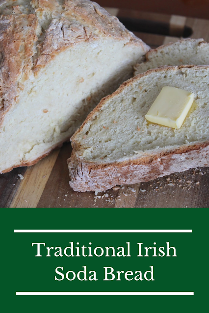 A loaf of Irish Soda bread on a cutting board.