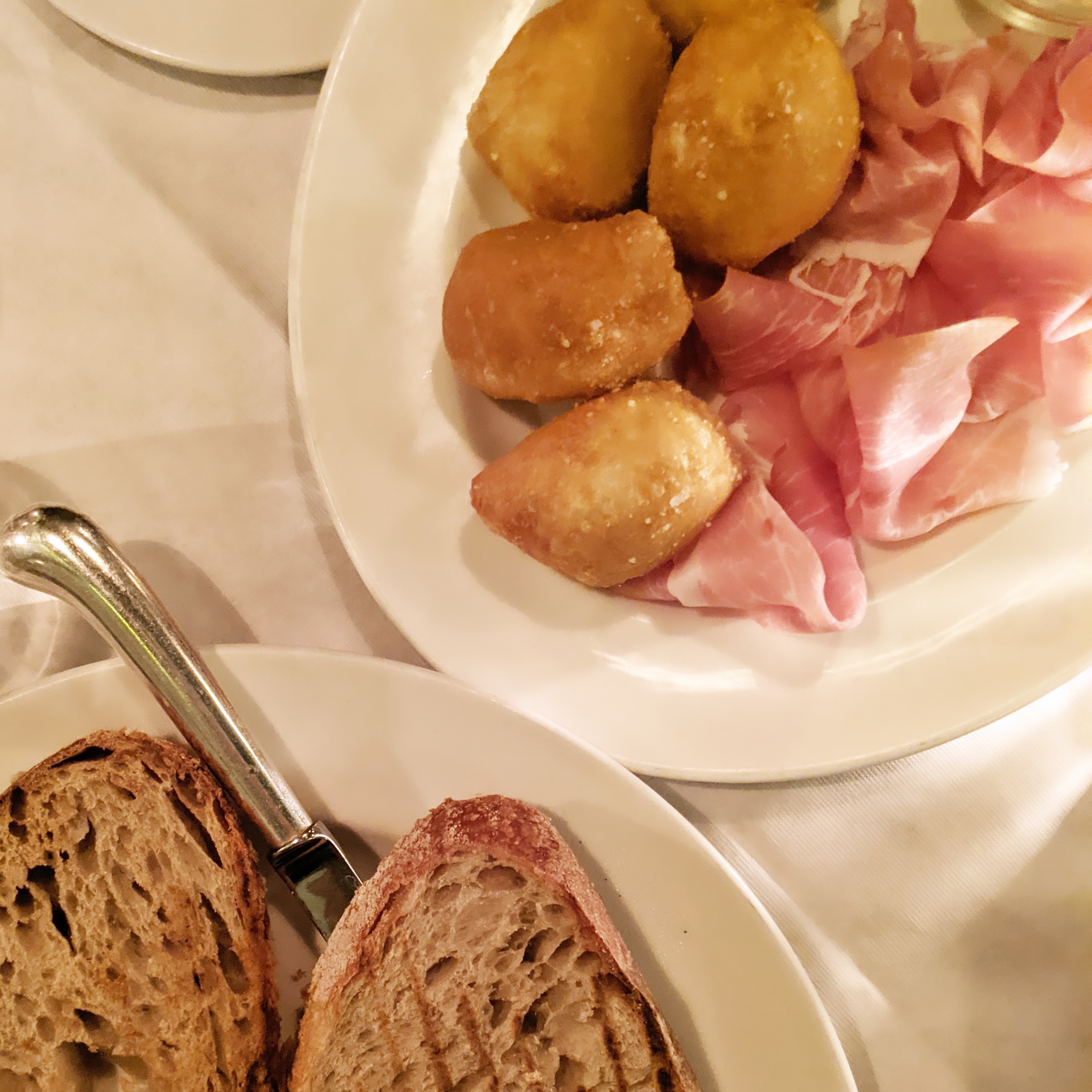 Plate of deep fried Dough cuddles with stracchino cheese and prosciutto at Brutto, one of the most authentic italian restaurants in london