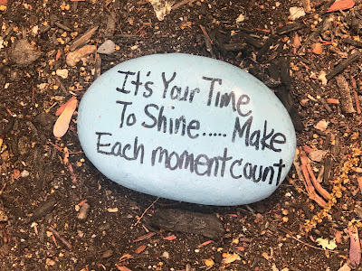 Rock with painted message: "It's Your Time to Shite...Make Each moment count"