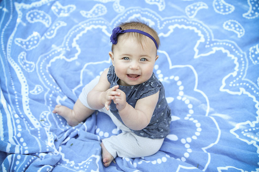 baby girl on blue towel
