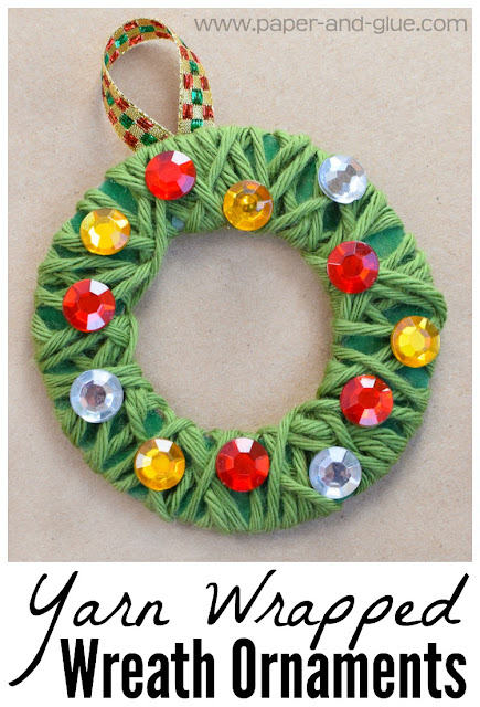 Yarn Wrapped Christmas Wreath Ornament Craft For Kids.  Fun and easy craft for preschool, kindergarten, or elementary.  Great fine motor work, with simple set-up for class parties.