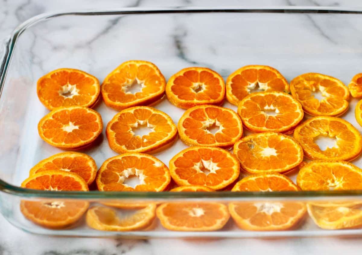 Greek Orange-Phyllo Cake Mandarin orange slices in a baking pan.