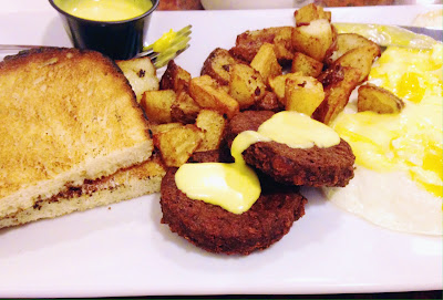 Two eggs over medium, home fries, local baked toast, veggie patties and homemade hollandaise sauce from Rox Diner in West Roxbury, Boston