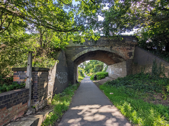 Turn left on The Alban Way head E under the bridge