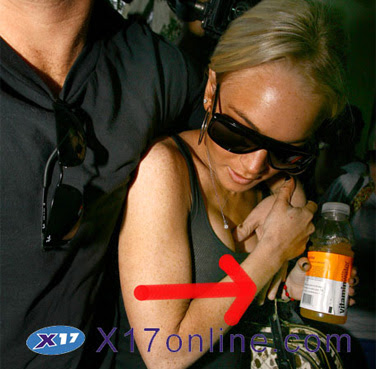 Lindsay Lohan's Boob Guard Lindsay's bodyguard cops a feel Sick
