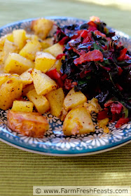 Fill your plate with vegetables--this dish consists of a heaping helping of sautéed Swiss chard and a side of roasted potatoes. A bit of bacon for flavor and you're ready to eat.