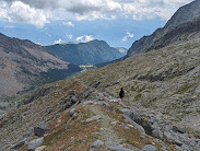 Walking down the moraine of the Predarossa Glacier