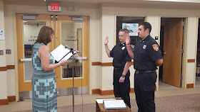 the swearing in of two new fire fighters/emergency medical technicians (EMT)