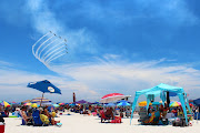 civilian air acrobatics fly over Gulf of Mexico during 2012 Pensacola Beach . (pensacola beach air show )