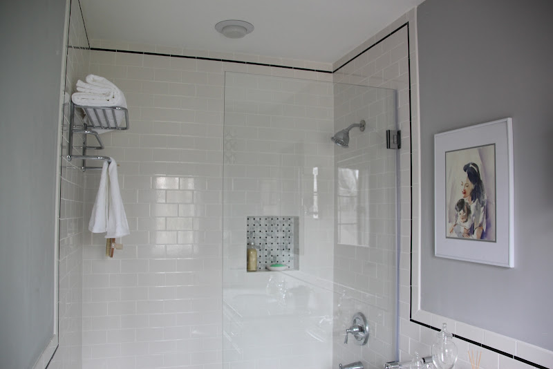 We used 3x6 white subway tiles with black pencil trim. The frameless  title=