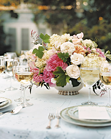 Love the centerpieces in footed silver bowls