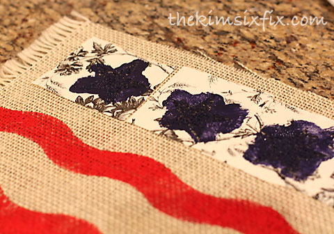 Stenciling stars on burlap