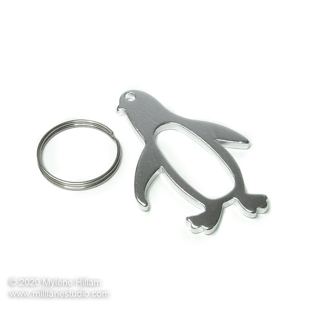 Silver penguin bottle opener and keychain ring