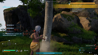 The player chops down a tree with his... fists... in Palworld.