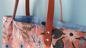 Leather handles, rivets, and a canvas Les Fleurs fabric by Rifle Paper Co. and Cotton + Steel make this a great tote bag for summer!