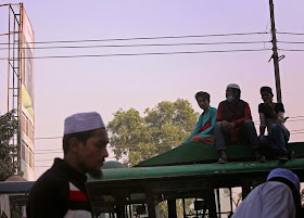 Bus passengers on roof