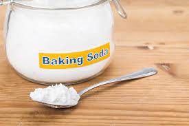 Baking soda in a pot and spoon