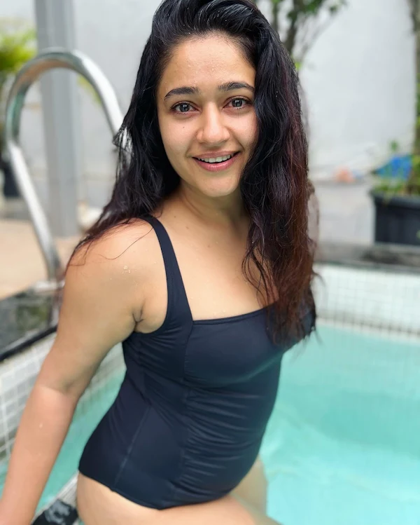 Poonam Bajwa black swimsuit curvy figure south indian actress