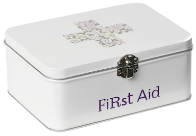 first aid tin with floral cross