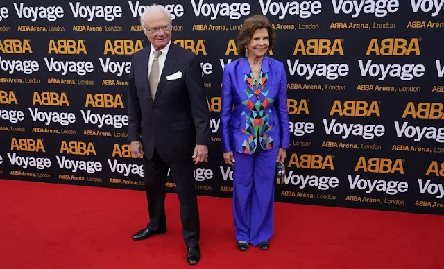 Queen Silvia wore a silk road outfit, blazer and trousers, by Mourjjan - Spring Summer 2016 collection. Swedish pop group ABBA. ABBA Arena